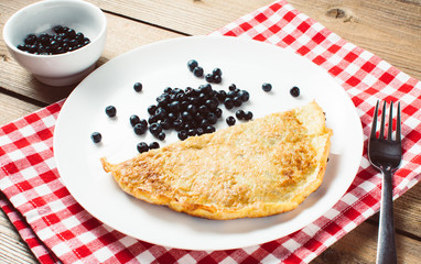 omelette with fruit and oat. top view