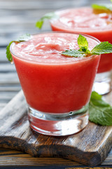 Watermelon smoothie and mint leaves.