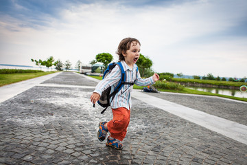 A boy is playing with soap bubbles.