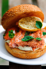 Fish burger with herb and lemon sauce.