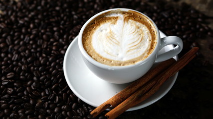 Cappuccino coffee with milk put on a table.