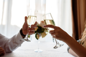 hand making toast with glass