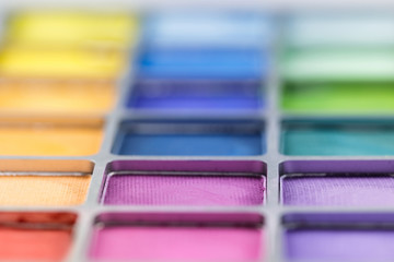 pallet of colored eye shadows, texture. Shallow depth of field