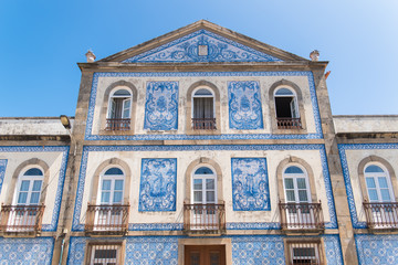 Fototapeta na wymiar Portugal, typical facade with blue azulejos, beautiful house 