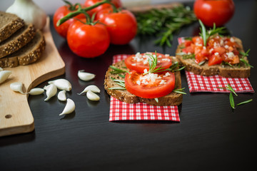 Healthy Food. Vegetarian food. Sandwiches with vegetables. Italian Bruschetta. Bread with chopped tomatoes, garlic, rosemary