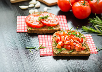 Healthy Food. Vegetarian food. Sandwiches with vegetables. Italian Bruschetta. Bread with chopped tomatoes, garlic, rosemary