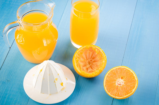 fresh orange juice on a blue background/fresh orange juice on a blue background top view