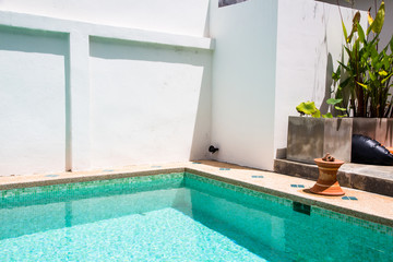 Modern backyard of a swimming pool with clear water
