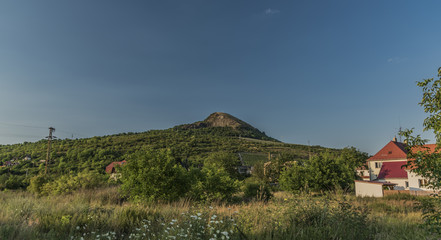 Radobyl hill in summer sunny evening
