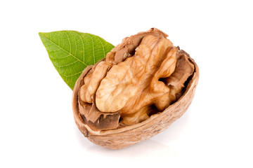 Walnut with leaf isolated on white background