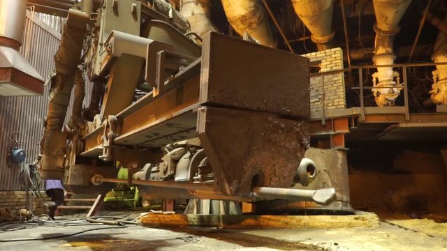 Equipment and machines at the metallurgical plant. Heavy industry. Stationary machines opening