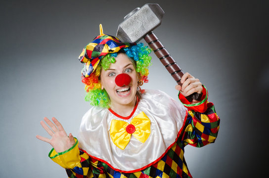 Funny clown in comical concept