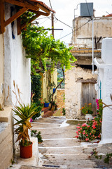 Fototapeta na wymiar Narrow street in the village of Kritsa near Agios Nikolaos, Crete, Greece