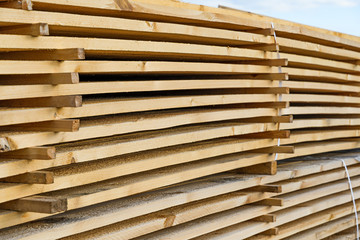 Board lying stacked and tied with a plastic cord