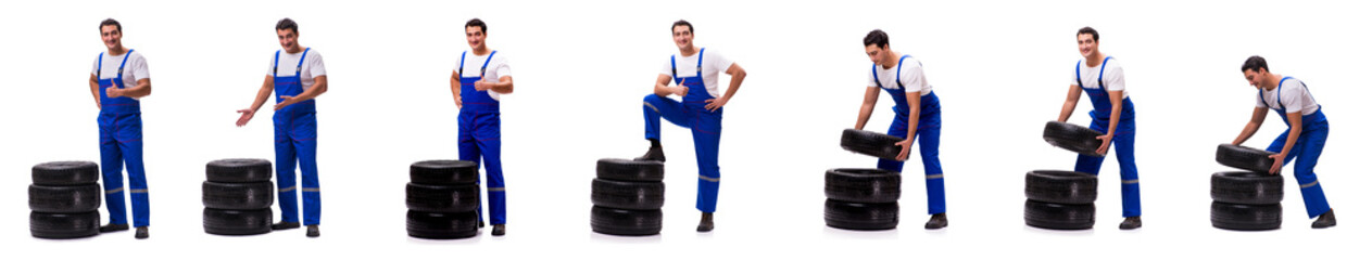 Handsome tyre repairman isolated on white