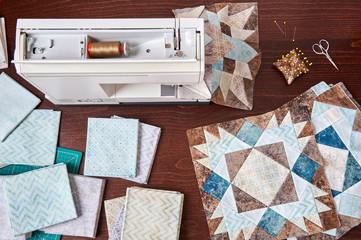 Sewing machine with patchwork block of quilt