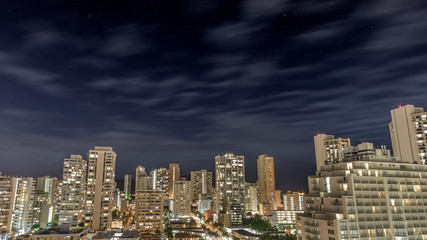 Naklejka premium Night Sky over downtown Waikiki Beach