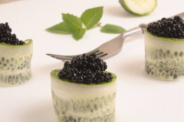 Black caviar on white background