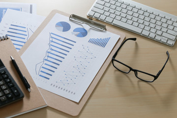 Checking financial reports paperwork and Business  Teamwork on Preparing report Blue graphs  glasses