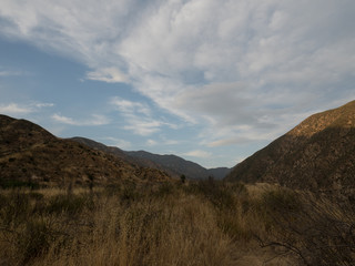 Cloudy sunset over a valley