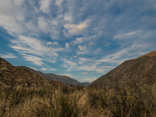 Cloudy sunset over a valley