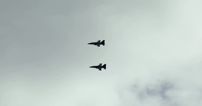 Video footage of silhouette of two fighter jet flying on the sky in Indonesian air show, shot in 4k resolution