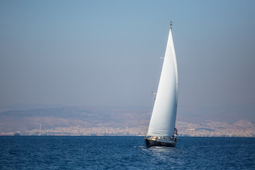 Obraz premium Sailing ship luxury yacht with white sails in the Sea.