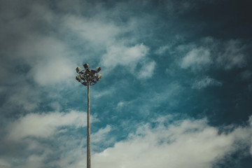 Lamp post electricity industry with blue sky. Spotlight tower.