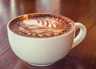 Coffee cup in coffee shop - vintage style effect picture