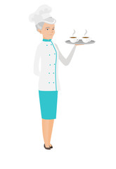Senior caucasian chef holding tray with cups.