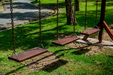 Wooden swing in the park