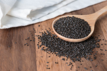 Basil seeds in spoon.