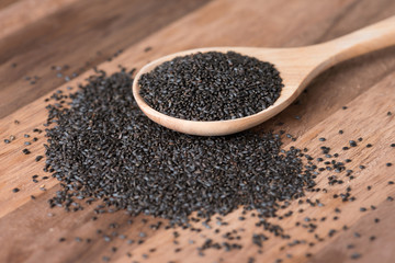 Basil seeds in spoon.