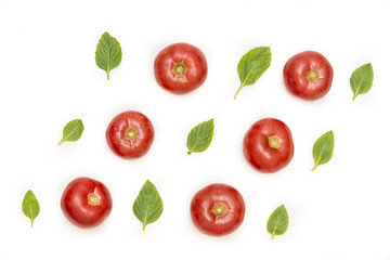 Tomatoes and basil leafs isolated on white background, food pattern