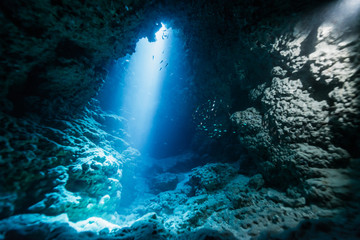 Rays of sunlight into the underwater cave