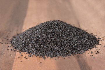Heap of sweet basil seeds.