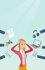 Young caucasian woman surrounded by her gadgets.