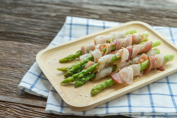 Grilled green asparagus wrapped with bacon