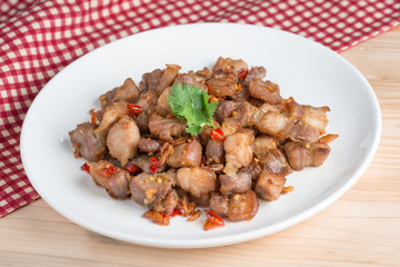 Fried pork crackling with garlic and chili.