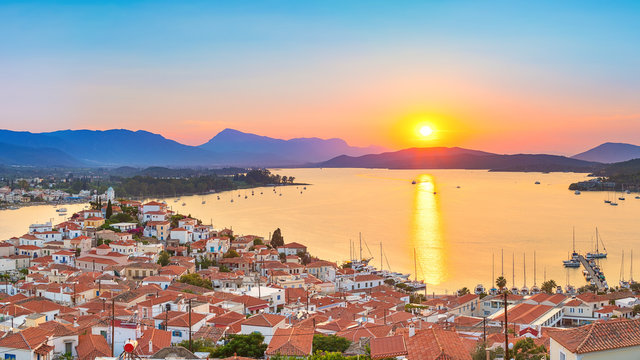 Fototapeta Sunset on Poros island in Aegean sea, Greece