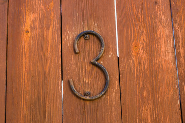 Door number 3 three conceptual image closeup.