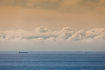 Naklejka na ściany i meble Seascape, ship on sea, horizon and sky.