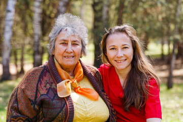 Happy elderly woman with her daughter