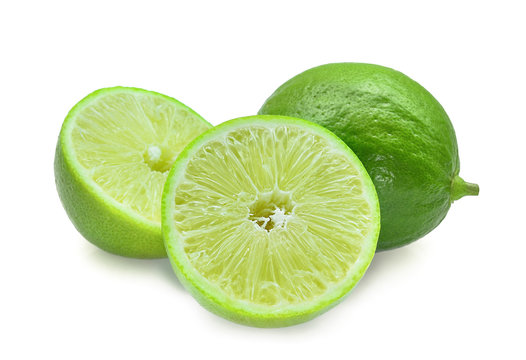 whole and half of fresh green lime isolated on white background