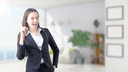 Young beautiful business woman and creative designer standing over blured interior background