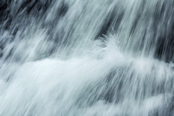 Fototapeta na wymiar Rushing water within Carpenter's Falls in Granby, Connecticut.