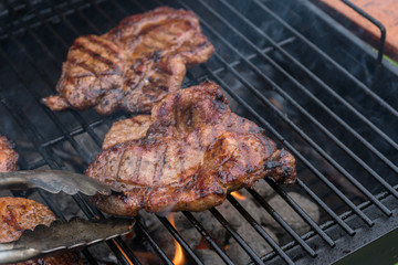 Delicious Grilled pork steak on the grill