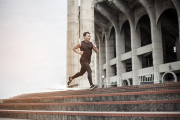 Handsome Sport man running at outdoor city