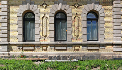 Fototapeta na wymiar Three windows in a small unknown church.