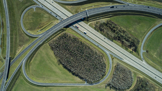 Aerial view of highways in field during sunny day, Berlin, Brandenburg, Germany